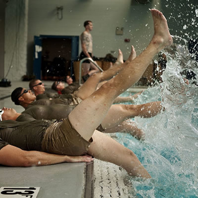 U.S. marines and sailors exercise in a pool