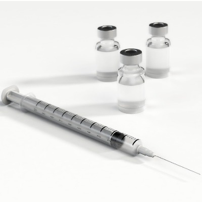 syringe with needle and vials of clear liquid